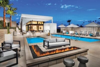 1 Cody Place Clubhouse Exterior Twilight Overall CC RET conversion1 1800 new homes Palm Springs Real Estate